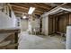 Unfinished basement area with utility sink, wooden work bench and exposed ceiling at 23 Timberlake Pointe Ne, Cartersville, GA 30121