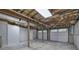 Spacious unfinished basement with concrete floor, exposed ductwork, and garage access at 23 Timberlake Pointe Ne, Cartersville, GA 30121