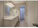 Bathroom featuring a long vanity with white cabinets and view to separate shower and toilet at 23 Timberlake Pointe Ne, Cartersville, GA 30121