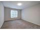 Bright bedroom featuring neutral carpet and a window that provides natural light at 23 Timberlake Pointe Ne, Cartersville, GA 30121