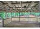 Covered wooden deck surrounded by lush trees providing a serene outdoor living space at 23 Timberlake Pointe Ne, Cartersville, GA 30121