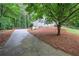 Charming two-story home with driveway, stone foundation and landscaped front yard at 23 Timberlake Pointe Ne, Cartersville, GA 30121
