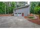 Exterior of home with two-car garage, red door, and concrete driveway at 23 Timberlake Pointe Ne, Cartersville, GA 30121