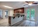 Modern kitchen with island, granite countertops, stainless appliances, and wood cabinets at 23 Timberlake Pointe Ne, Cartersville, GA 30121