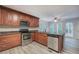 Updated kitchen with stainless steel appliances, stone countertops and wooden cabinetry at 23 Timberlake Pointe Ne, Cartersville, GA 30121