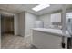 Basement kitchenette with white cabinets, sink, and refrigerator at 23 Timberlake Pointe Ne, Cartersville, GA 30121