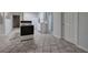 Basement kitchenette with electric range and tile floor at 23 Timberlake Pointe Ne, Cartersville, GA 30121