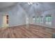 Open-concept living room features hardwood floors, vaulted ceiling, and seamless flow to other living spaces at 23 Timberlake Pointe Ne, Cartersville, GA 30121