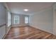 Inviting living area featuring beautiful hardwood floors, large windows, and neutral paint at 23 Timberlake Pointe Ne, Cartersville, GA 30121