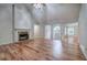 Spacious living room with hardwood floors, stone fireplace, and ample natural light at 23 Timberlake Pointe Ne, Cartersville, GA 30121