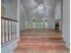 Inviting living room features vaulted ceilings, hardwood floors, and a cozy stone fireplace at 23 Timberlake Pointe Ne, Cartersville, GA 30121