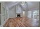 Bright and airy living room with hardwood floors, stone fireplace, and French door access at 23 Timberlake Pointe Ne, Cartersville, GA 30121