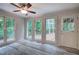 Sunroom with large windows, views of the trees and door to deck at 23 Timberlake Pointe Ne, Cartersville, GA 30121