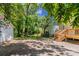 Open backyard area with a wooden deck, mature trees, and ample space for outdoor activities at 3361 Myrtle St, Atlanta, GA 30354