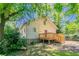 Lush backyard with a wooden deck, mature trees, and a well-maintained lawn at 3361 Myrtle St, Atlanta, GA 30354