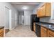 View of kitchen with appliances and light brown cabinetry, featuring tile flooring at 3361 Myrtle St, Atlanta, GA 30354