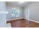 Living room with hardwood floors, fireplace, and natural light from a window at 3361 Myrtle St, Atlanta, GA 30354
