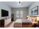 Virtually staged main bedroom featuring ceiling fan, modern décor, and updated floors at 3361 Myrtle St, Atlanta, GA 30354