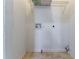 Utility room with hook ups, storage shelf, and neutral flooring at 3361 Myrtle St, Atlanta, GA 30354