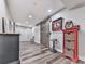 Finished basement showcasing stylish flooring and a rustic sliding barn door at 5039 Towne Lake Hills North, Woodstock, GA 30189