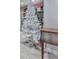 Cozy, finished basement corner featuring a white Christmas tree and vintage sewing machine detail at 5039 Towne Lake Hills North, Woodstock, GA 30189