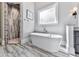 Bathroom with freestanding tub and walk-in shower at 5039 Towne Lake Hills North, Woodstock, GA 30189