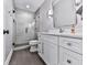 Modern bathroom with glass-enclosed shower and white vanity at 5039 Towne Lake Hills North, Woodstock, GA 30189