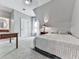 Bright bedroom with slanted ceiling, neutral carpet, comfortable bed, and en-suite bathroom at 5039 Towne Lake Hills North, Woodstock, GA 30189