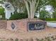 Entering the North section of Towne Lake Hills, signified by a classic brick and sign at 5039 Towne Lake Hills North, Woodstock, GA 30189