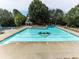 Large community pool with lap lanes, lounge chairs, and a gazebo in a wooded setting at 5039 Towne Lake Hills North, Woodstock, GA 30189