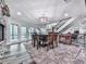 Open dining area features natural light, modern lighting, and wood floors at 5039 Towne Lake Hills North, Woodstock, GA 30189