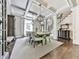 Elegant dining room features coffered ceilings, pendant lighting, and a spacious table for gatherings at 5039 Towne Lake Hills North, Woodstock, GA 30189