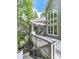 Exterior features multilevel deck, wooded view, and outdoor living area at 5039 Towne Lake Hills North, Woodstock, GA 30189