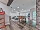 Open game room with foosball table, beanbag chairs, and wood floors at 5039 Towne Lake Hills North, Woodstock, GA 30189