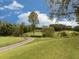 Scenic view of the community golf course with well-manicured greens and blue sky at 5039 Towne Lake Hills North, Woodstock, GA 30189