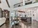 Open-concept kitchen featuring an island with seating, stainless steel appliances, and dark hardwood floors at 5039 Towne Lake Hills North, Woodstock, GA 30189