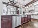 Well-appointed kitchen with a large island, stainless steel appliances, and beautiful hardwood floors at 5039 Towne Lake Hills North, Woodstock, GA 30189