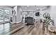 Open-concept living room offers hardwood floors and great light at 5039 Towne Lake Hills North, Woodstock, GA 30189