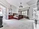 Large main bedroom featuring a ceiling fan, ample natural light, and a private balcony at 5039 Towne Lake Hills North, Woodstock, GA 30189