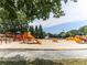 Vibrant community playground featuring slides, swings, and climbing structures for active fun at 5039 Towne Lake Hills North, Woodstock, GA 30189
