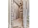 Walk in shower with pebble tile flooring, wood look wall tiling, and neutral accents at 5039 Towne Lake Hills North, Woodstock, GA 30189