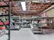 Unfinished basement provides ample storage space with shelving units and visible insulation at 5039 Towne Lake Hills North, Woodstock, GA 30189