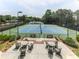 Enjoy a match on these well-maintained tennis courts with an inviting patio area for relaxation at 5039 Towne Lake Hills North, Woodstock, GA 30189