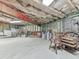 Large unfinished basement area with exposed insulation and wooden beams offering storage at 5039 Towne Lake Hills North, Woodstock, GA 30189