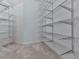Unfinished walk-in closet with customizable shelving and ample space for organization at 5039 Towne Lake Hills North, Woodstock, GA 30189