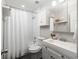 This bathroom has white subway tile, a white vanity, and updated hardware at 520 Park Se Ave # 2, Atlanta, GA 30312