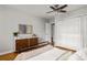 This bedroom has a modern feel with neutral walls, and wood accents on the dresser at 520 Park Se Ave # 2, Atlanta, GA 30312