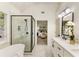 Modern bathroom with soaking tub, glass shower enclosure, double sinks, and stylish fixtures at 5860 Fairway View Dr, Suwanee, GA 30024