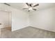 Clean, unfinished bedroom with plush carpet, white trim, and a ceiling fan at 5860 Fairway View Dr, Suwanee, GA 30024