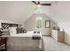 Charming bedroom with vaulted ceilings, ample natural light, and neutral decor at 5860 Fairway View Dr, Suwanee, GA 30024